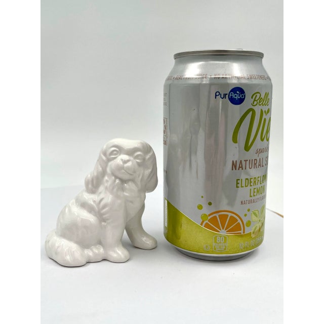 This charming vintage Blanc de Chine ceramic figurine of a Pekingese dog measures approximately 2.75 inches wide, 1.75...