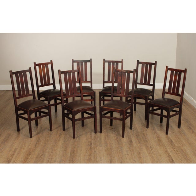 High Quality Antique Early 20th Century Set of Eight Oak Dining Chairs with Slatted Backrests and Leather Seats, Designed...