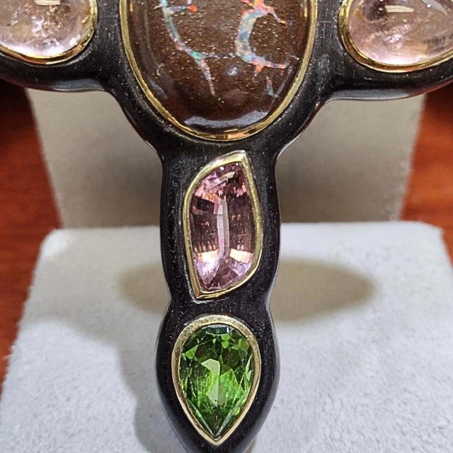 Extraordinary Christopher Walling-designed carved ebony cross with boulder opal center, two pear-shaped (faceted)...