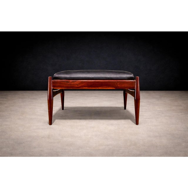 This mid-century ottoman by Liceu de Artes e Ofícios is crafted in solid rosewood and upholstered in its original black...
