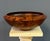 A beautifully hand-turned claro walnut bowl by American wood artist Bruce Mitchell, dated 1981. This sculptural vessel...