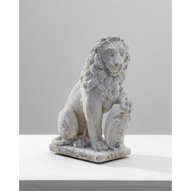 20th Century French Concrete Lion Sculpture. This expressive French lion sculpture, cast in concrete, captures a classic...