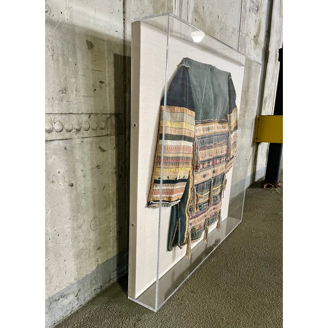 Black star jacket from Southeast Asia Hmong people Laos, early 20th century A boldly decorated jacket with bright applique...