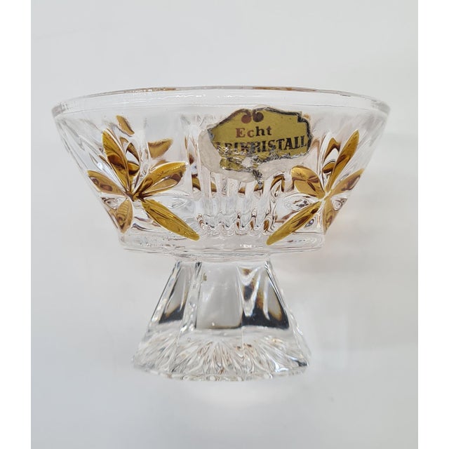 An elegant, complete set for serving spirits, consisting of a decanter with an original stopper and five glasses. The...