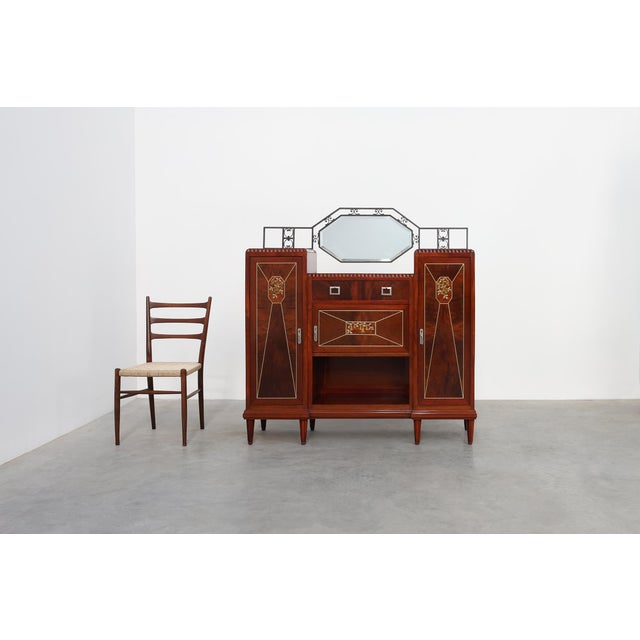 An exceptional Belgian Art Deco cabinet of remarkable decorative quality, dating from around 1925. Executed in the manner...