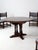 This vintage Jacobean Revival dining table set is perfect for intimate dinners or gatherings of up to six people. The...