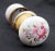 This vintage passage door knob set includes two white ceramic door knobs with a colorful floral motif and two polished...