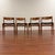 Set of four vintage teak low back dining chairs made in Denmark by Hong Stolefabrik circa 1960's. These chairs feature...