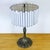 Vintage table lamp featuring an ornate bronze base and an original leaded white opaline glass shade, composed of...