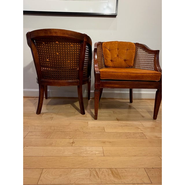 Cane Back: Skillfully woven cane in excellent condition Upholstery: Rich velvet fabric in a striking burnished orange...