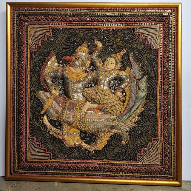 A wonderful antique Burmese tapestry featuring Loka-Nat riding Garuda, an eagle humanlike god. The padded figures are cut...