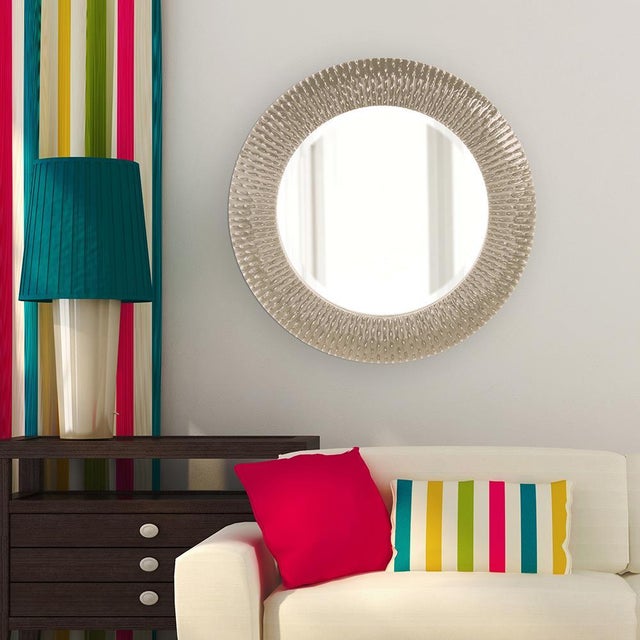 Bergman features a round frame characterized by a textured ribbed frame. It is then painted with our custom glossy nickel...