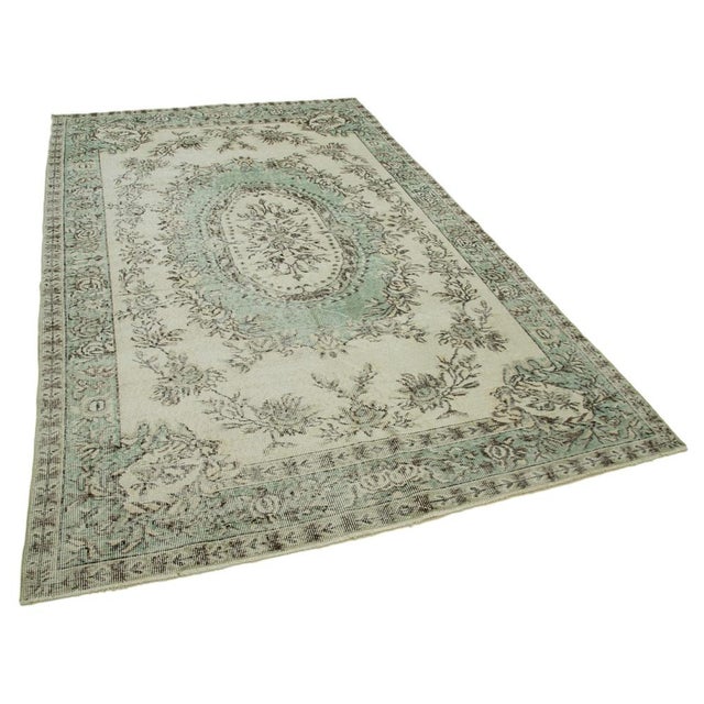 Turkish vintage rugs, typically around 60 to 70 years old, are prized for their historical significance and exceptional...