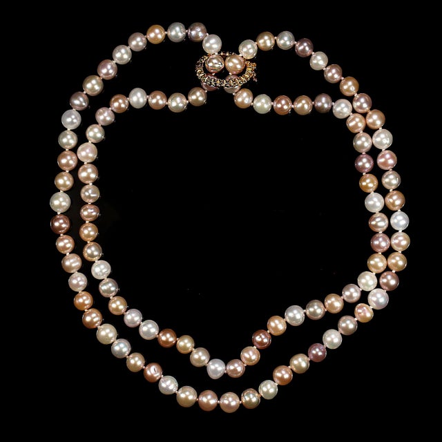 This stunning 37‑inch necklace features an elegant strand of multicolor 8mm freshwater pearls, each one individually...