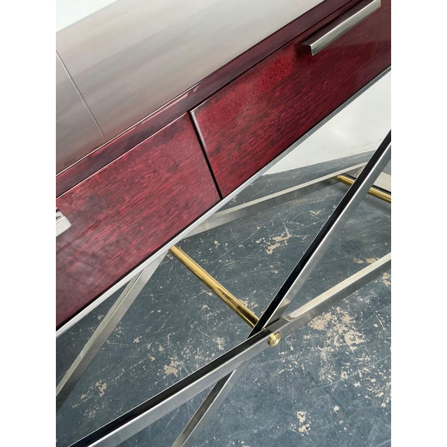 This striking vintage console table embodies the refined elegance of mid-century modern design through its confident mix...