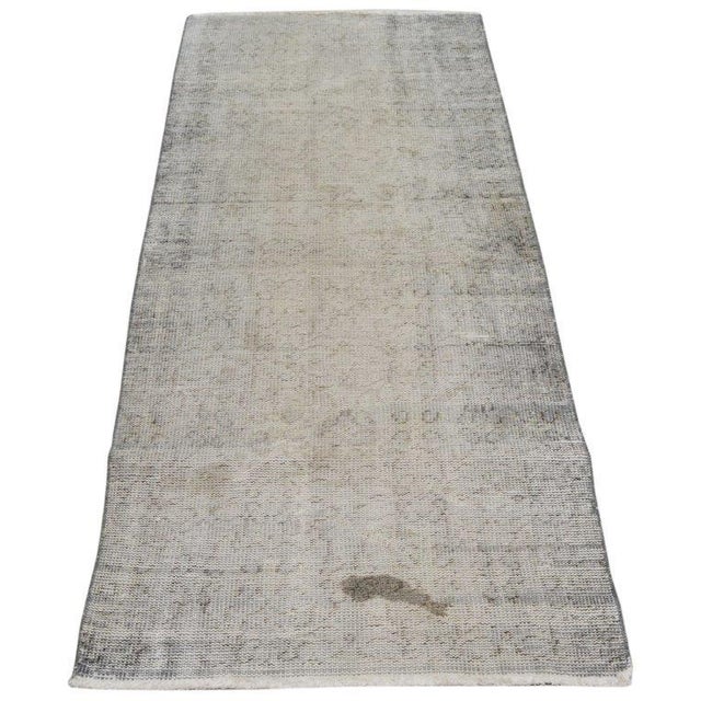 Hand-knotted with care using traditional rug-making techniques, this wool rug blends timeless craftsmanship with a modern...