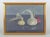 M. Arborelius. Oil on panel. Still life with onions and garlic. 1979 a still life with onions and garlic rendered in muted...