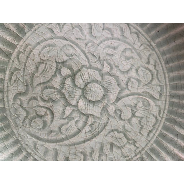 Bring a classic touch of Asian elegance to your home decor with this large, vintage celadon-glazed ceramic charger plate....