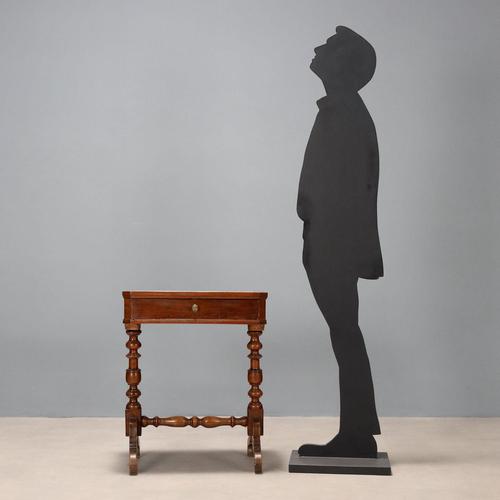 Walnut work table. Drawer compartments in the lower section, two turned legs resting on curved feet with curled ends and...