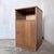 a compact mid-century american-style teak bedside cabinet with an open shelf for books and everyday essentials. The simple...