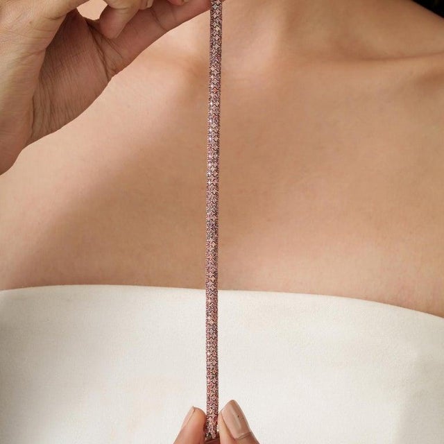 A classic golden orange sapphire rope bracelet crafted in 925 sterling silver, offering a warm and luminous take on a...