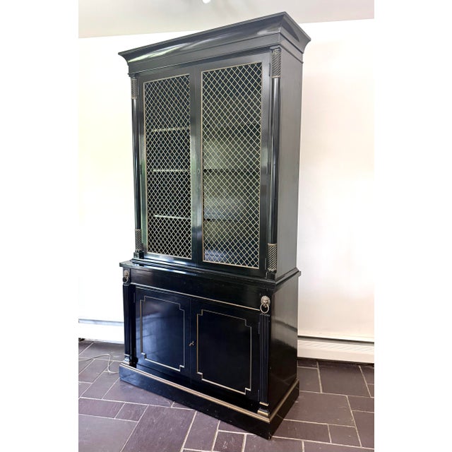 An impressive ebonized / French polish black lacquer French Empire / Regency china or display cabinet made by Kittinger...