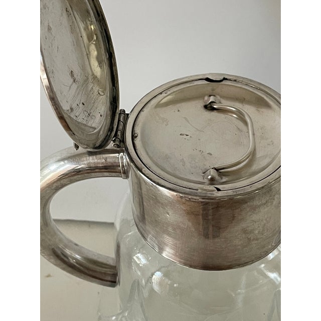 Vintage crystal cut silverplate water jug with insert.
