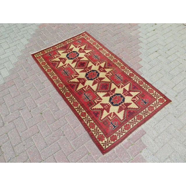 This beautiful, traditional vintage, hand knotted Turkish area rug is approximately 60 years old. It is handmade of very...
