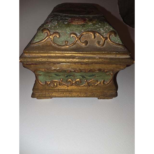 Charming antique French or Italian paint decorated box in green and gold with worn roses and a center medallion that is a...