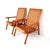 Pair of Mexican Mid-Century Modern woven lounge chairs made in the 1950s. Featuring simple but elegant modern frames and a...