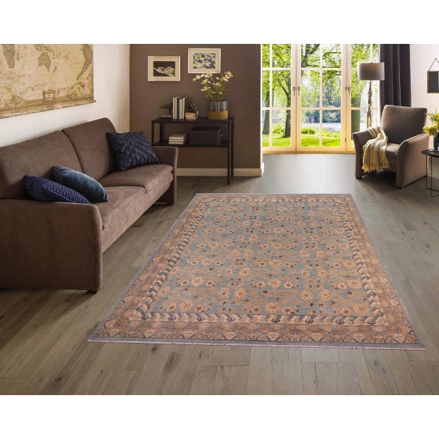 "Enhance the ambiance of your home with this magnificent Persian-influenced Turkish hand-knotted rug made by skilled...