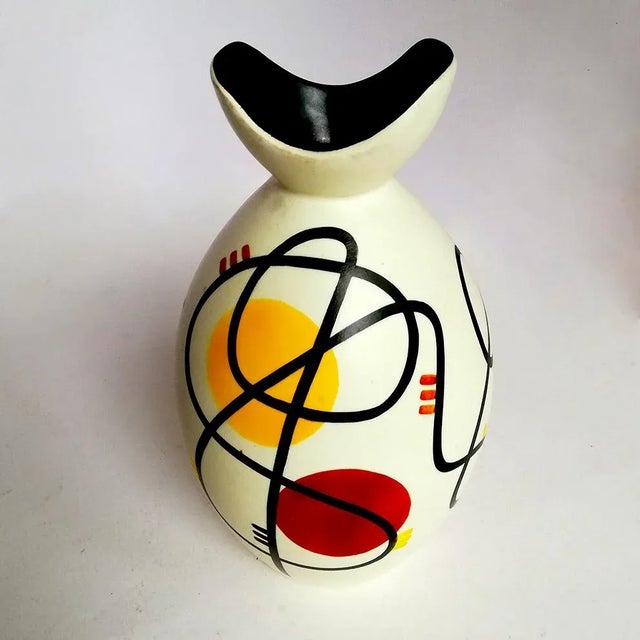 This is a vase with abstract decorations on a white background and is signed: Ceramiche Campionesi.