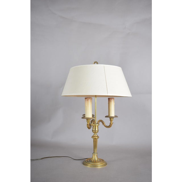 French bouillotte lamp — delicate gilt brass with cream fabric shade an exquisite and refined french bouillotte lamp of...