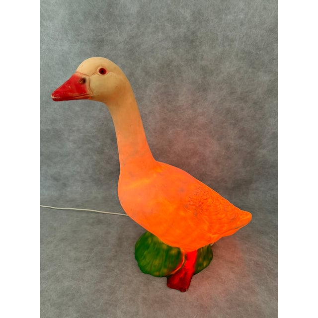 Figural goose-shaped lamp produced by the German manufacturer HEICO. The lamp features a very long cable, allowing it to...