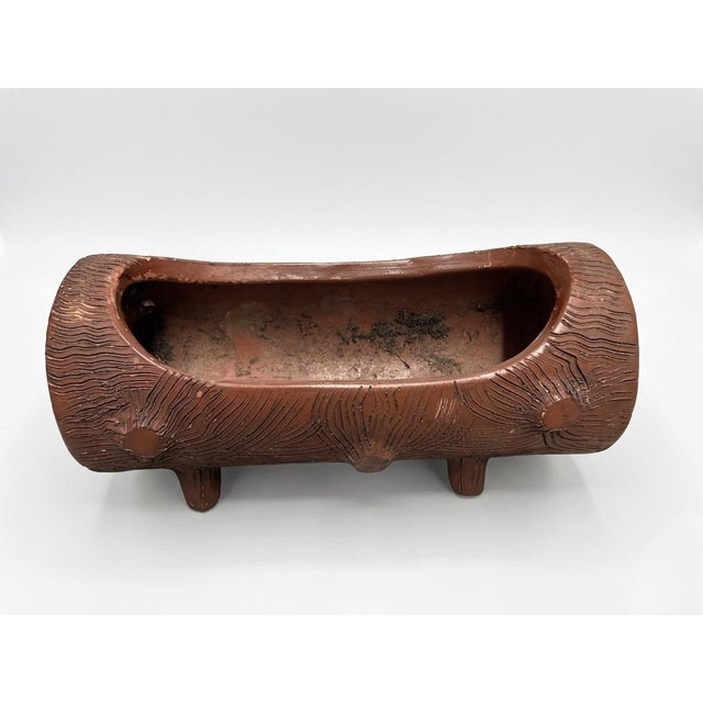 This charming vintage terracotta planter is masterfully crafted in the faux bois (false wood) tradition, designed to mimic...