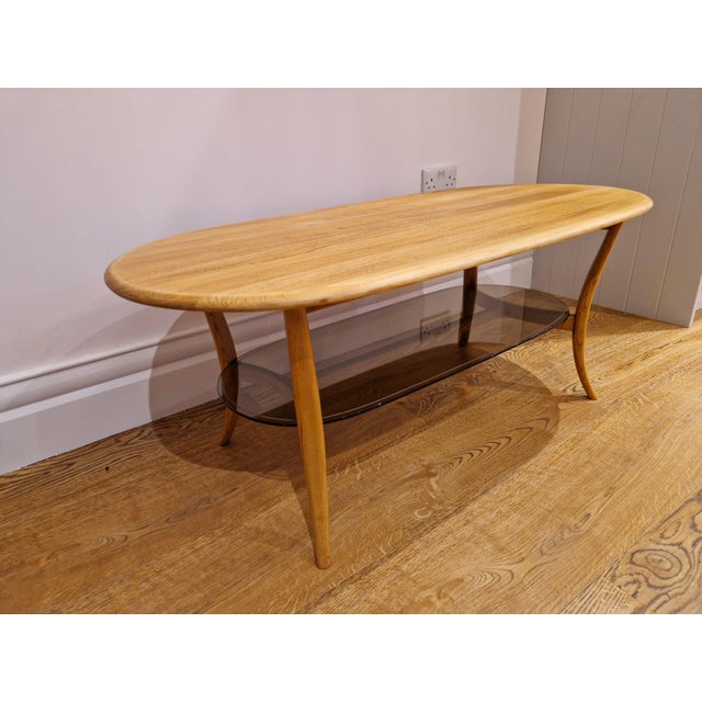 1970s Mid-Century Blonde Oval Coffee Table Smoked Glass from Ercol, 1970s For Sale - Image 5 of 11