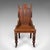 This is an antique Gothic Revival hall chair. A Scottish, oak baronial reception seat, dating to the Victorian period,...