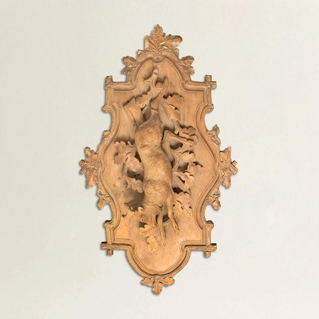 A fantastic late 19th century Bavarian hand-carved fruitwood hunt plaque depicting a roe deer hanging from a wooden peg...