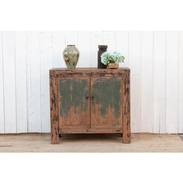 Charming vintage country cabinet – a rustic wood masterpiece featuring primitive construction and a distressed two-tone...