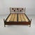 Italian mid-century bed Osvaldo Borsani & Arnaldo Pomodoro, 1950s Double bed featuring a dark wood frame and gilded brass...