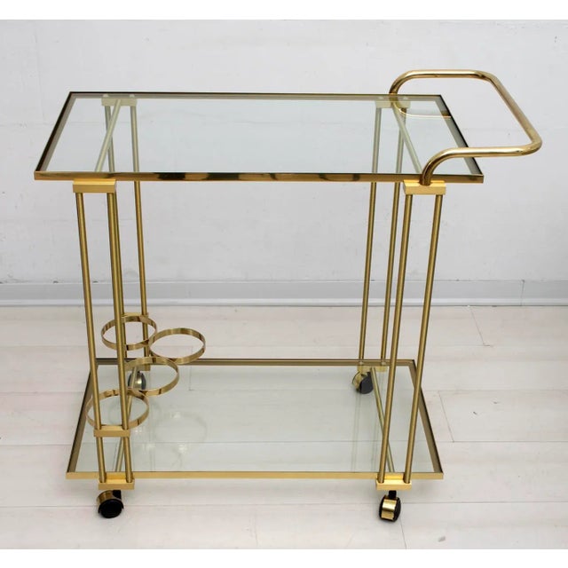 Mid-Century brass bar cart, circa 1970s. It is versatile in size and can be used as a bar or serving cart or as additional...