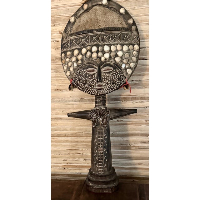 This vintage African fertility goddess figure is a hand-carved wood statue from Ghana, standing at 20 inches tall and 8”...