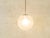 Classic Bauhaus-era spherical ceiling lamp by Peill & Putzler from the 1950s. The lampshade is made of frosted opal glass...