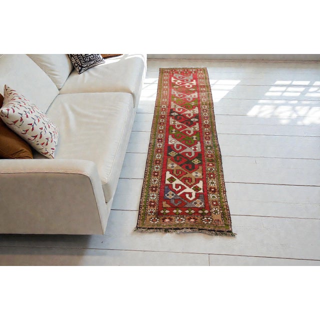 This is a vintage Turkish Oushak rug from the Mid 20th Century. The piece was hand-knotted.