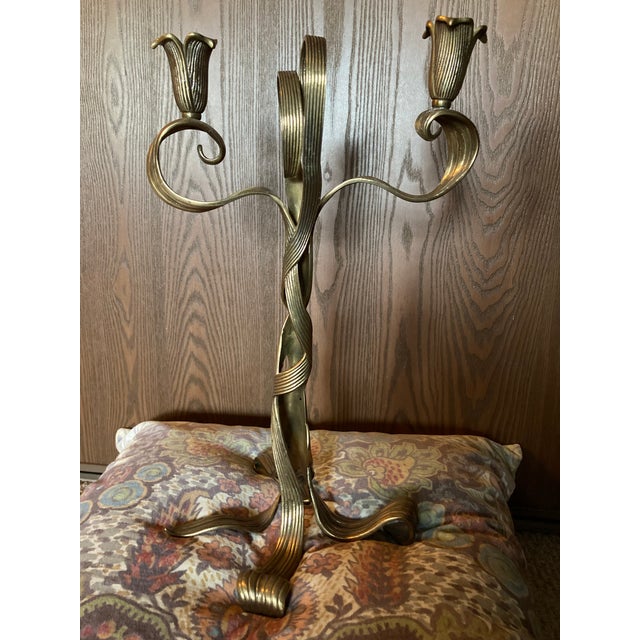 Tall solid brass candlestick by Chapman. Twisted, ribbon or tree-like flow to this piece. Could use a good deep cleaning,...
