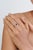 This elegant ring showcases a 1.17 carat pear-cut blue sapphire, set in 14K two-tone gold. The center stone measuring 7.7...