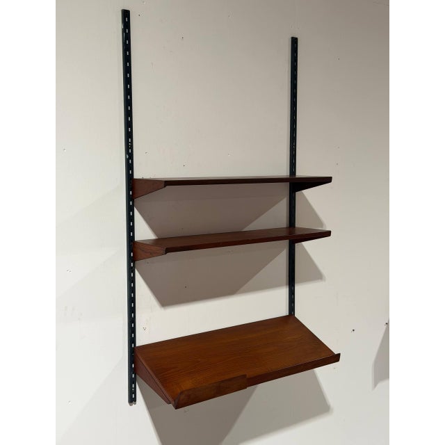 This modular wall unit combines clean Scandinavian lines with versatile open display space. Crafted with rich grain...