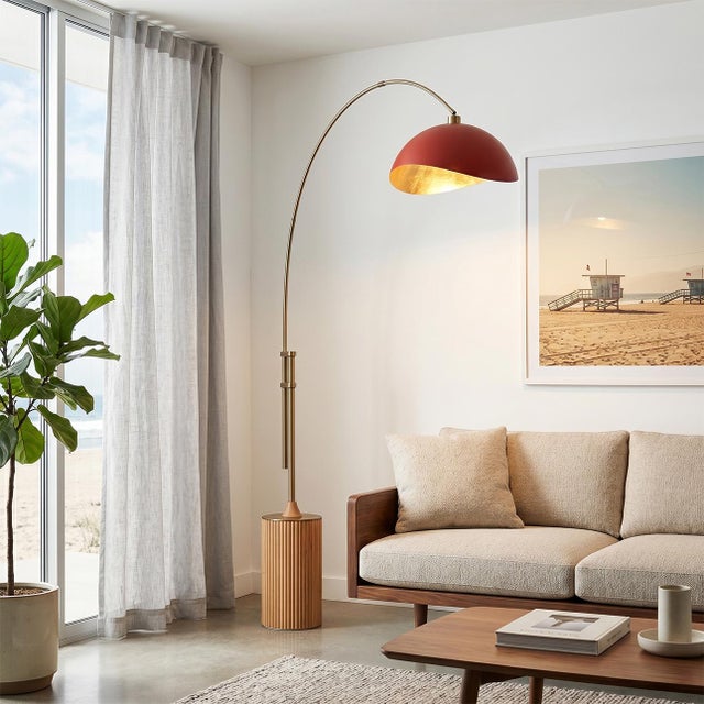 The Tambo Arc Lamp is a dimmable mid-century modern lighting piece designed by Peter Morelli in 1984. This elegant arc...