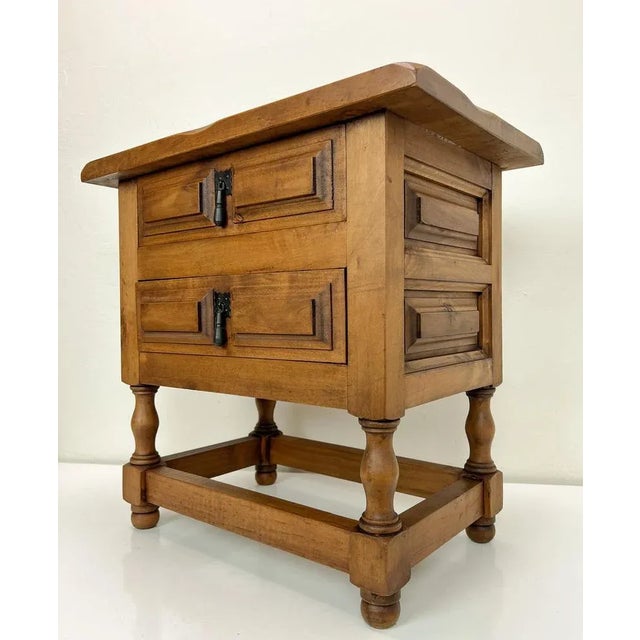 Charming small chest of drawers in Spanish Baroque style in honey-color wood with 2 drawers. Very nicely finished and with...