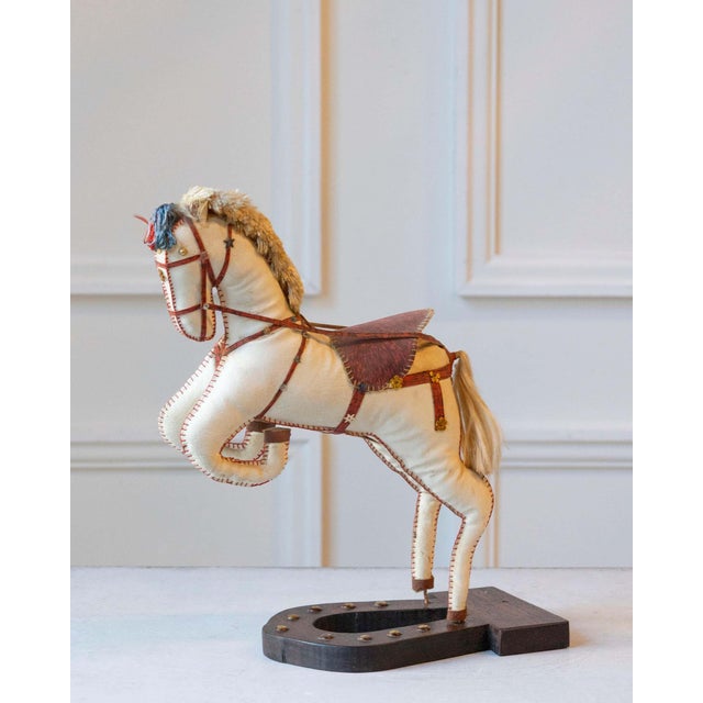 Charming and sculptural, this French decorative horse from the 20th century captures the elegance and vitality of...